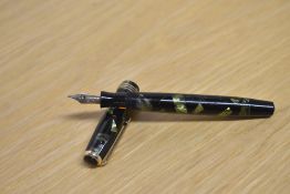 A Parker Duofold Deluxe Challenger Junior button fill fountain pen in Green and Black marble with