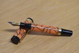 A boxed Sigma converter fill fountain pen in Orange Swirl having Iridium Point Germany nib