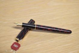 A boxed Parker Sonnet converter/cartridge fill fountain pen in Laque Firedance with gold trim having