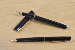 A Waterman Concorde cartridge fill fountain pen and Ballpoint pen in black with gold trim having