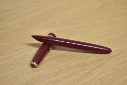 A Parker Lady aerometric fill fountain pen in Burgundy with decorative cap band.