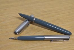 A Parker 51 aerometric fill fountain pen and Propelling pencil in Grey with a Lustraloy cap with