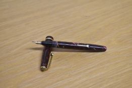 A Conway Stewart Dinkie 560 lever fill fountain pen in rose and black marble having Conway 14ct gold