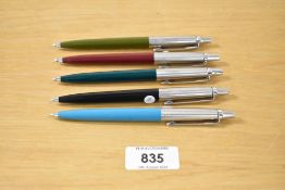 Five 1960's Parker Jotter ballpoint pens in olive green, aqua, black, burgundy and forrest green (