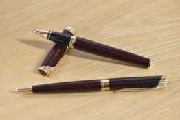 A Waterman L'Etalon Rollerball and Ballpoint pen in Burgundy with gold trim