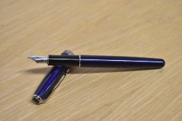A Parker Sonnet converter fill fountain pen in Laque Dark Blue with silver trim having Parker 18K