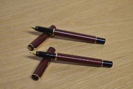Two Parker Rialto converter fill fountain pens in Metallic Maroon