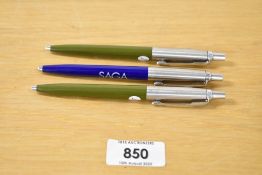 Three Parker Jotter advertising ballpoint pens two in olive green and the other blue