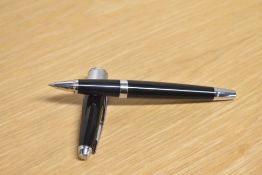 A boxed Cross Apogee rollerball in Black Star laque and chrome