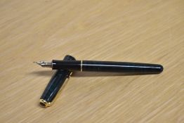 A Parker Sonnet converter fill fountain pen in Laque Forest Green with gold trim having Parker 18K