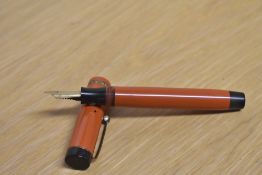 A Parker Duofold Senior button fill fountain pen in Big Red with single wide cap band having