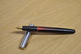 A Parker Frontier converter fill fountain pen in Red and Black with stainless steel cap with gold
