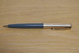 A Parker 51 propelling pencil in grey with rolled gold cap.