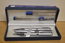 A eight piece pen set includes fountain pen, ballpoint pen and propelling pencil as well as