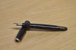 A Parker Vacumatic in Gold Pearl with two narrow bands to the cap having Parker 14K Pen N nib.