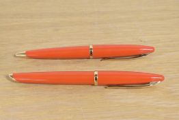 A Waterman Carene Rollerball and Ballpoint pens in Coral Orange