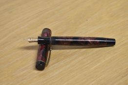 A Parker Duofold Junior button fill fountain pen in Burgundy and Black marble with two narrow cap