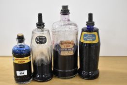 Four large Waterman ink bottles all with ink
