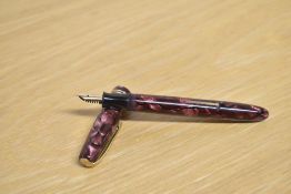 A Burnham No56 lever fill fountain pen in Rose marble with two narrow bands to the cap having