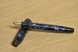 A Parker Duofold button fill fountain pen in Blue and Black marble with a narrow cap bands having