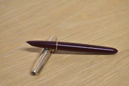 A Parker 51 aerometric fill fountain pen in Burgundy with a Rolled Gold cap
