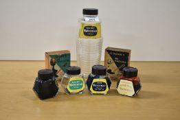 Four Waterman Encre 2oz ink bottles, a large Watermans Encre ink bottle and two boxed Sloans Ink