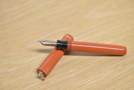 A Sheaffer No46 lever fill fountain pen in orange with single narrow band to the ring top cap having