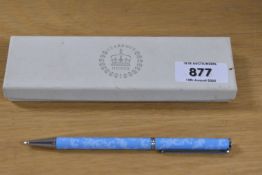 A boxed Clarance House ballpoint pen in pale blue with foliated decal