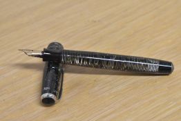 A Parker Vacumatic fountain pen in Grey Pearl with three narrow bands to the cap having Parker