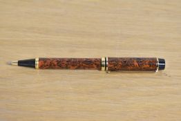 A Waterman Rhapsody ballpoint pen in Red Ripple with gold trim