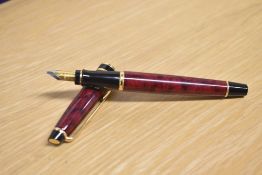 A boxed Waterman Expert converter fill fountain pen in Flame Red with gold trim having a Waterman