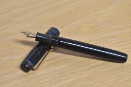 A Parker Duofold Junior button fill fountain pen in Blue and Black marble with two narrow cap