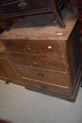 A pitch pine chest of four drawers, with inset brass back plates and handles 87cm