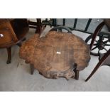 A 20th century transverse wood section coffee table raised on a trestle style base, L68cm x h38cm