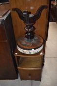 A Victorian revolving piano stool with padded circular top above the action and gadrooned column,