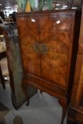 A vintage burr walnut cocktail cabinet in the Queen Anne style, h133cm