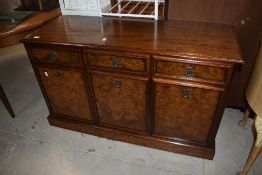 A vintage mahogany sideboard having three drawers and three cabinet doors, L121cm