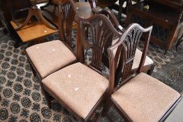 A set of four George III mahogany dining chairs, of Hepplewhite design, seat height 47cm