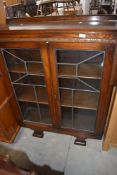 A 1930's/40's oak display cabinet with moulded folded detail and geometric glazing 120cm x 90cm x