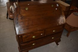 An Oriental teak bureau , the flap having campaign style handles, width approx. 100cm