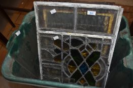A group of five early 20th century leaded and stained glass window panels