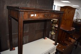 A George III mahogany fold over tea table, of traditional design with single drawer and butterfly