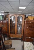 A early 20th century oak and glass cabinet, h170cm Condition report: damaged