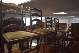 A set of four 20th century oak ladder back chairs, with dralon covered drop in seats, seat height