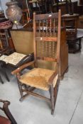 A 19th century rocking chair having rush seat and bobbin back, h117cm