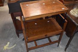 A mid century oak cantilever tea trolley 48cm wide x 43cm deep