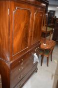 A 19th century mahogany press cupboard of traditional design with dentil moulded cornice, re-entrant