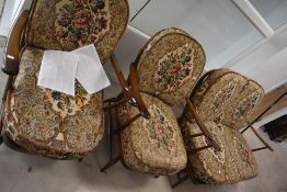 A mid-century Ercol elm and beech 2 seater sofa having spindle backs and floral upholstery, L134cm,