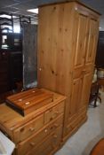 A two door pine wardrobe, h192cm x w80cm x d53cm, sold together with a 2 over 3 chest, h84cm x
