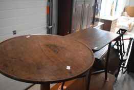 A 19th century mahogany stem table with slightly dished circular top over a turned gun barrel stem